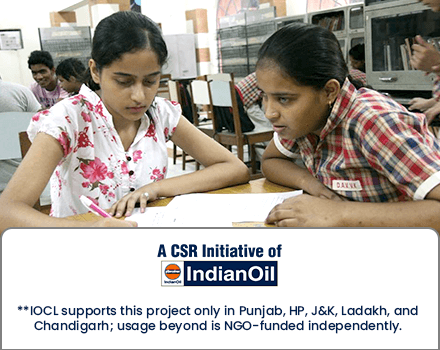 Two girls studying together in a library setting, supported under the IndianOil CSR initiative. Note: IOCL supports this project only in Punjab, HP, J&K, Ladakh, and Chandigarh; other usage is NGO-funded.