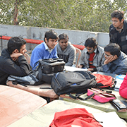 Group of students sitting and studying together outdoors
